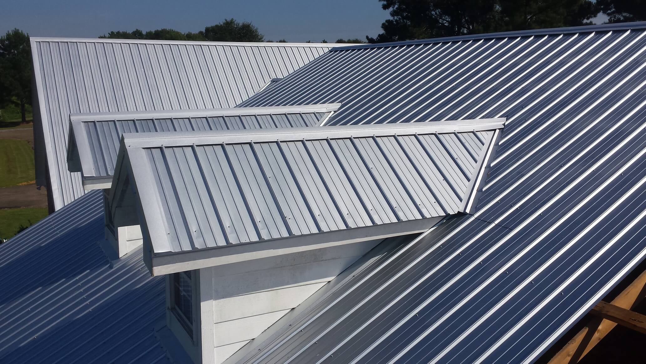 Exposed-fastener metal panel roof detail on dormers